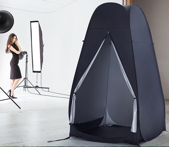 Pop-up privacy tent photographed in a studio