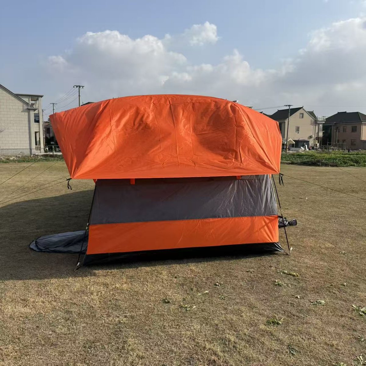 Tailgate tent side view showing the porch awning extended over the tailgate — Armand Outdoor wholesale